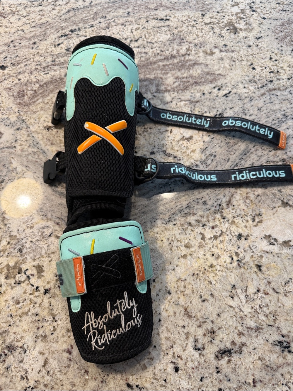 Absolutely Ridiculous Kids Protective Shin Guard in Mint, Black and Orange